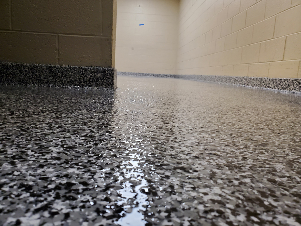 Modern basement with a seamless metallic epoxy floor